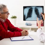 Picture of a doctor explaining early stage NSCLC to a patient