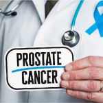 Picture of a doctor holding a note with prostrate cancer written on it